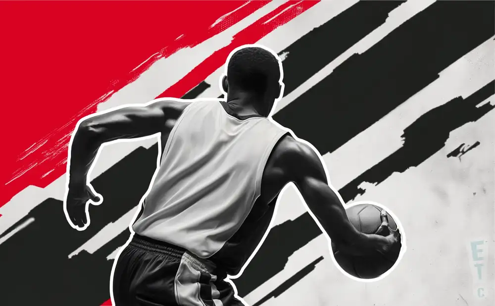 an atlanta hawks basketball player reaching for the basketball in the air